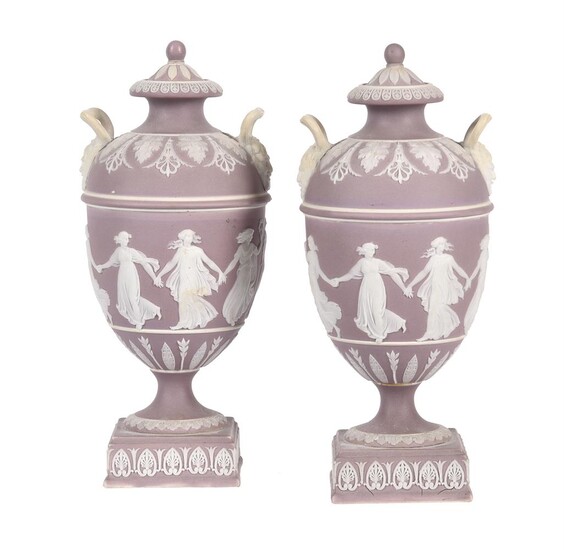 A pair of Wedgwood lilac-dip Jasper two handled urns and covers