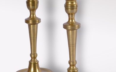 A pair of bronze candlesticks, late 18th century.