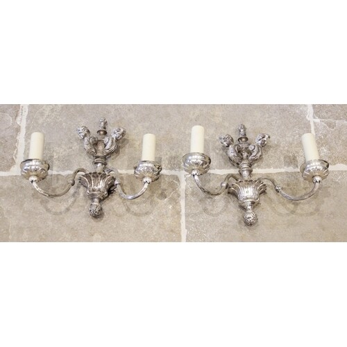 A pair of chromed metal twin branch wall light sconces, earl...