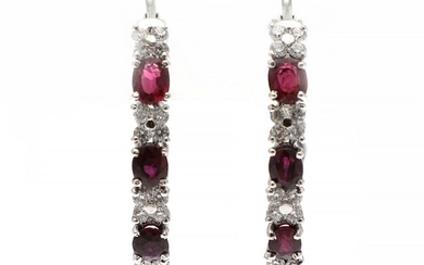 NOT SOLD. A pair of diamond and ruby ear pendants each set with numerous brilliant-cut...