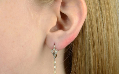 A pair of early 20th century platinum and old-cut diamond and seed pearl pierced drop earrings.