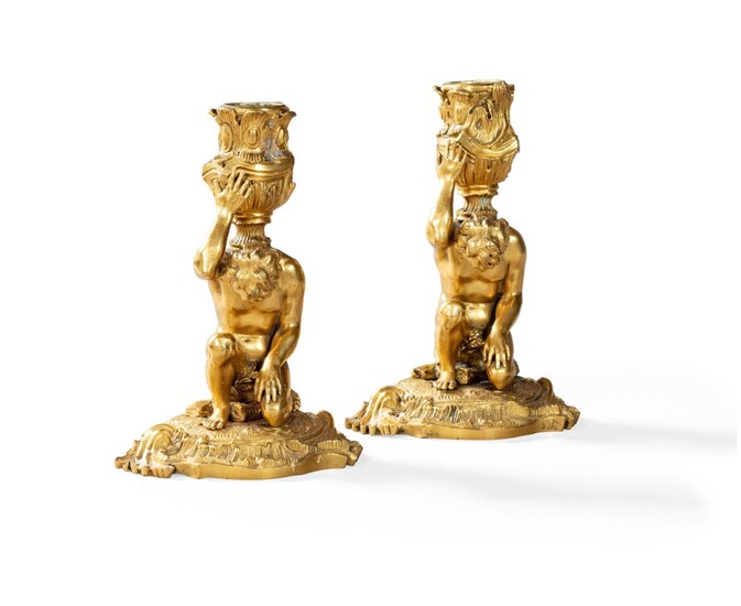 A pair of giltbronze candelsticks, 19th century | Paire de flambeaux en bronze doré, XIXeme siècle