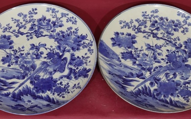 A pair of large 19th/20th Century round chargers on...