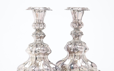 A pair of silver rococo candlesticks, 20th century.