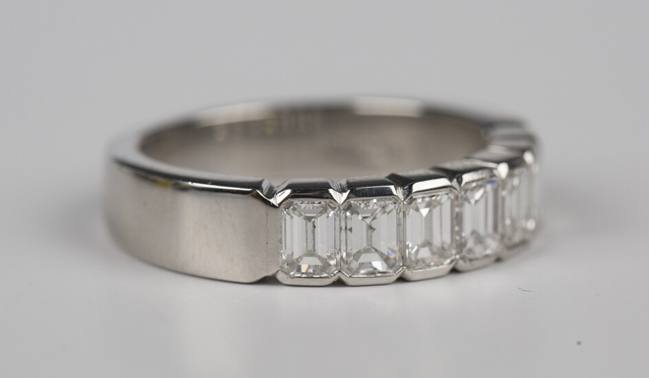 A platinum and diamond ring, mounted with seven baguette cut diamonds, total diamond weight approx 2