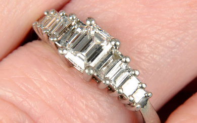 A platinum graduated baguette-cut diamond dress ring.