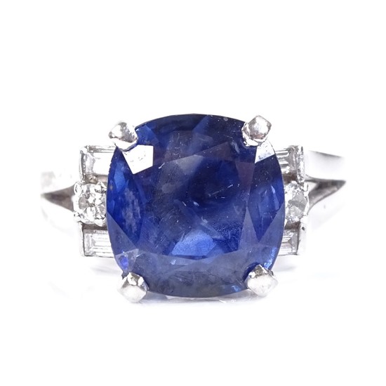 A platinum sapphire and diamond dress ring, set with cushion...