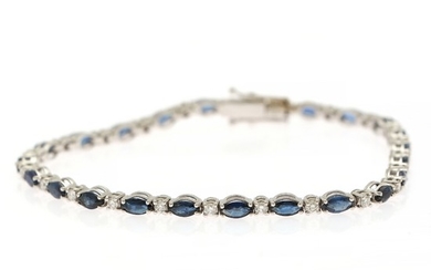 A sapphire and diamond bracelet set with numerous marquise-cut sapphires and numerous brilliant-cut diamonds, mounted in 18k white gold. L. 17.6 cm.