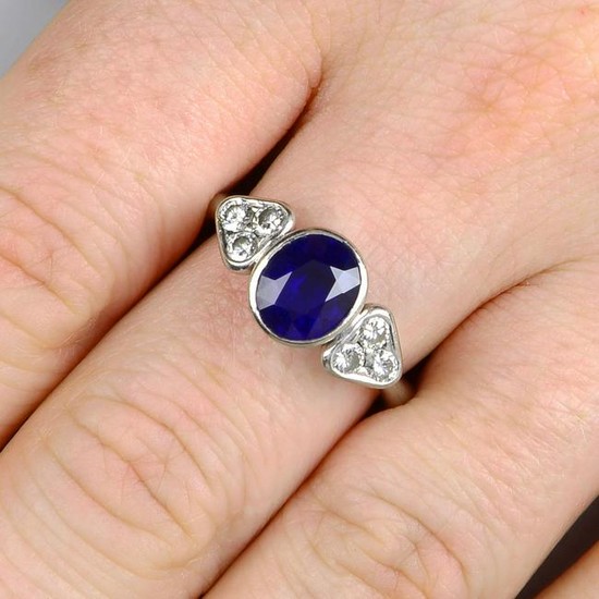 A sapphire and diamond dress ring.Estimated dimensions