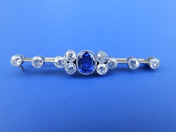 A sapphire & diamond millegrain set bar brooch, the...