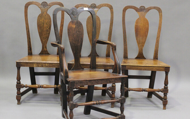 A set of four early 18th century provincial oak splat back dining chairs, the solid seats on turned