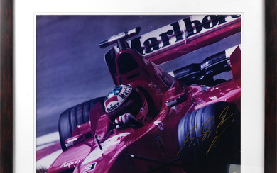 A signed photograph of Michael Schumacher