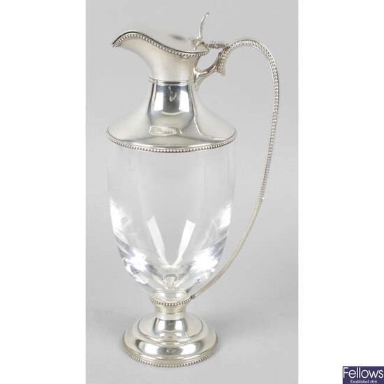 A silver mounted claret jug.