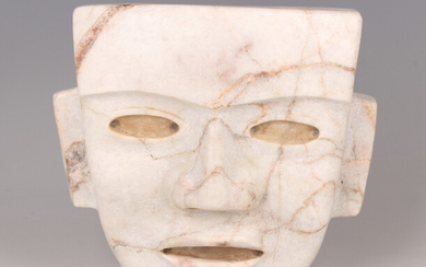 A substantial pre-Columbian Teotihuacan style carved cream hardstone mask, probably 250-700 AD, with