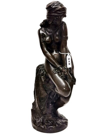 A superb signed bronze figure of a slave girl, c. 1900. Signed on reverse, H. 46cm.