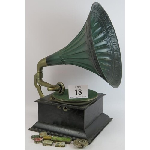 A vintage wind up gramophone with steel horn and oak case pl...