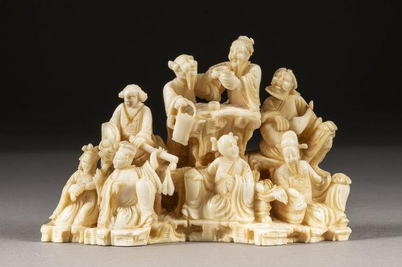 AN IVORY CARVED 'THE EIGHT IMMORTALS'