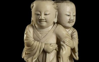 AN IVORY DOUBLE SNUFF BOTTLE SHAPED AS TWO CHILDREN