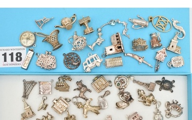 ASSORTED SILVER AND WHITE METAL CHARMS, to include a silver ...