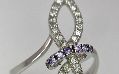 An 18K White Gold CZ Fancy Knot Ring. Size...