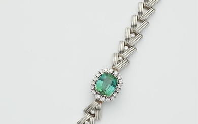 An 18k white gold diamond and green tourmaline bracelet.