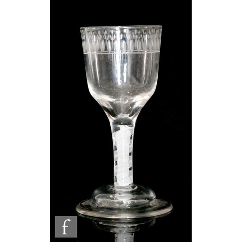 An 18th Century drinking glass circa 1775, the ogee bowl eng...