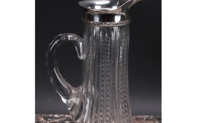 An American silver mounted cut glass wine jug, star-cut base...