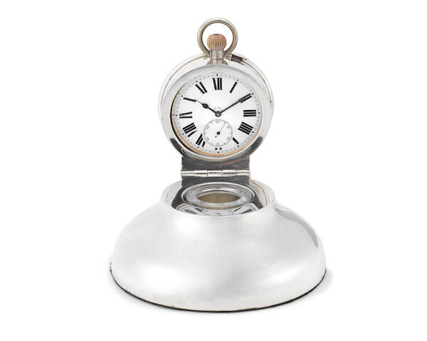 An Edwardian silver timepiece inkwell