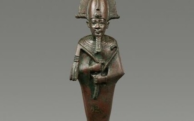 An Egyptian Bronze Osiris Height 11 3/4 inches.