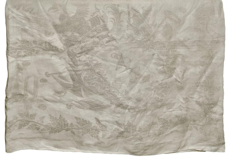 An Irish commemorative 'Battle of Trafalgar' linen damask tablecloth, Lisburn, 19th century, almost certainly woven by Coulson & Sons, the central cartouche with the fleet in formation and the inscription Trafalgar October 21 1805 / England expects...