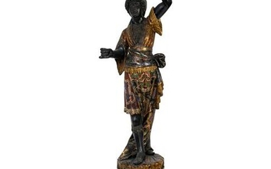 An Italian Carved and Painted Torchere of a Moor on a