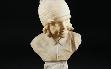 An alabastrer female head with a cap