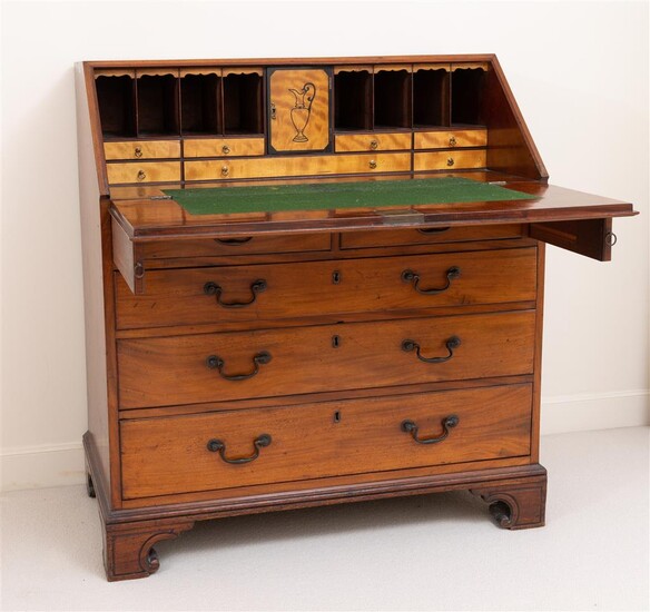 An antique mahogany bureau with two short and three long...