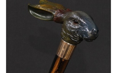 An early 20th century novelty walking stick, the handle fine...