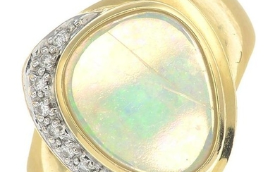 An opal and diamond dress ring.Stamped 18K.Ring size L.