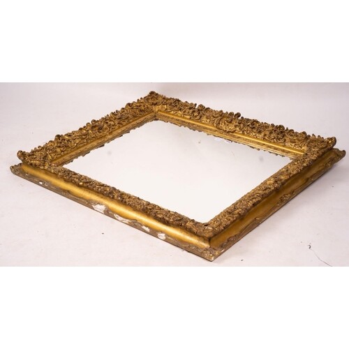 An ornate Victorian giltwood and gesso rectangular wall mirr...