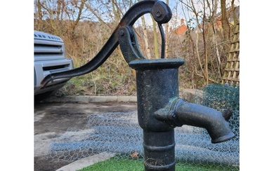 Antique cast iron water pump garden feature