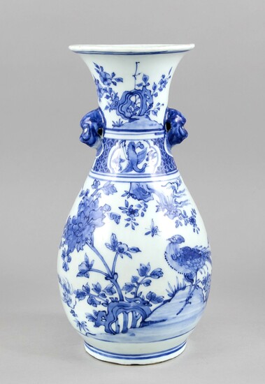 Blue and white vase, China, 19th/20th cent. Bulbous body with two applications in the form of heads at the neck (probably to mount a thin rope or a leather strap), underglaze blue decoration shows various birds, flowers and insects, frieze on the neck...