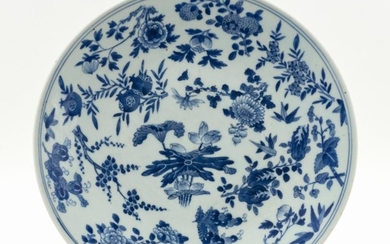 CHINESE BLUE AND WHITE PORCELAIN CHARGER Decorated with lotus fruit and various flowers. Diameter 13.5".