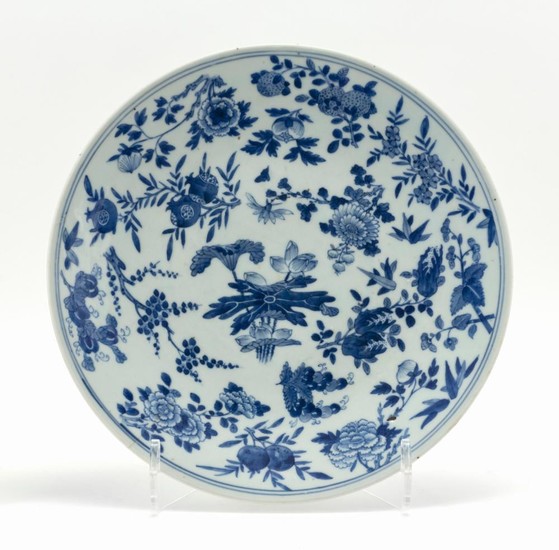 CHINESE BLUE AND WHITE PORCELAIN CHARGER Decorated with lotus fruit and various flowers. Diameter 13.5".