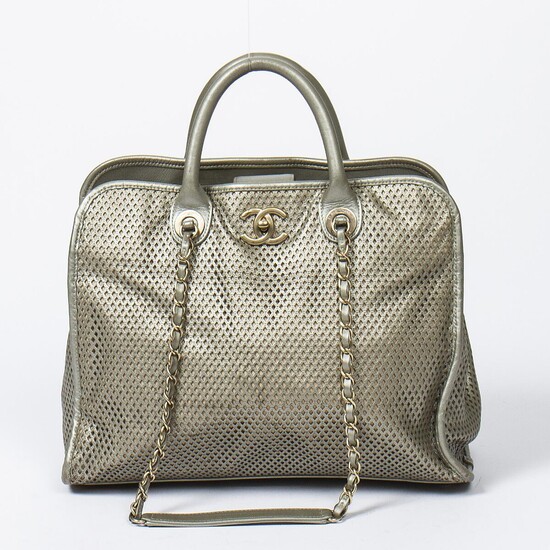NOT SOLD. Chanel: An "Up In The Air" bag of grey perforated leather, leather trimmings, gold tone hardware, two handles and two chain shoulder straps. – Bruun Rasmussen Auctioneers of Fine Art