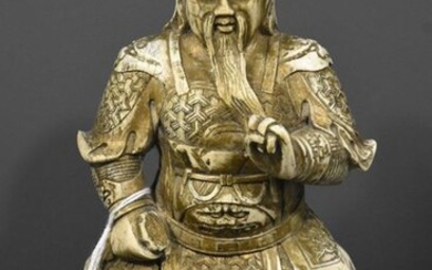 China, early 20th century, Guan-Yu sitting on a rock holding his sword in his right hand and making a mudra with his left hand, in mammoth ivory (height 21cm, 1768grs) with certificate