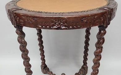 Circa 1900 Carved Oak leather top round table with barley twist legs & stretcher. Dia 24" h 28".