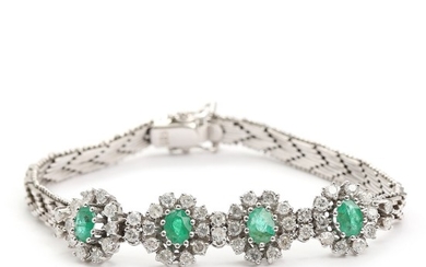 Emerald and diamond bracelet set with four faceted emeralds encircled by numerous brilliant-cut diamonds, mounted in 14k white gold. L. 18.5 cm.