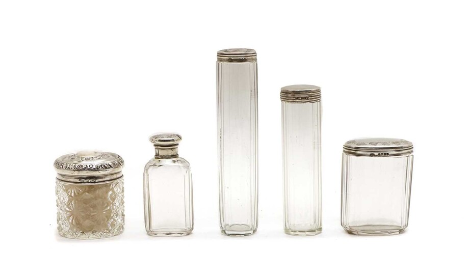Five silver lidded cut glass dressing table jars