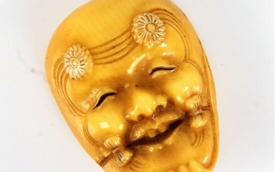 Japanese ivory Noh mask netsuke, the mask with flower heads to the forehead, 3.5cm high