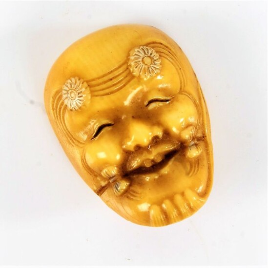 Japanese ivory Noh mask netsuke, the mask with flower heads to the forehead, 3.5cm high