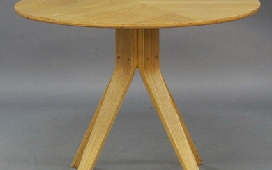 Matthew Hilton (b.1957) for Case, a 'Cross' centre table, c.2015, the circular top on splayed and tapered supports, 74cm high, 90cm diameter