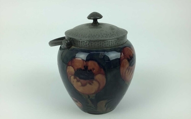 Moorcroft pewter mounted biscuit barrel decorated in the poppy pattern on blue and green ground