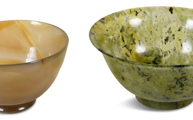 ONE CHINESE THIN-WALLED SPINACH JADE BOWL AND AN AGATE CUP Diameter of bowl: 4 in. (10.2 cm.), Diameter of cup: 3 in. (7.6 cm.)